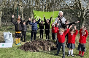 Image shows the school children with head teacher Caroline Pryer