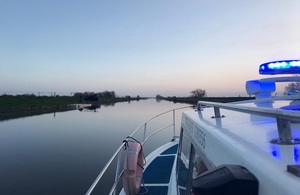 The front of an EA patrol boat on an empty river.