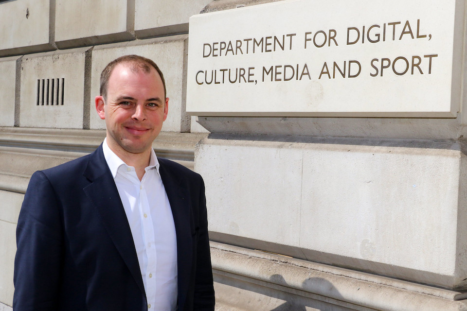 A picture of Matt Warman MP, Minister for Digital Infrastructure, standing outside the Department for Digital, Culture, Media and Sport