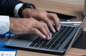 Image of person working at a laptop computer
