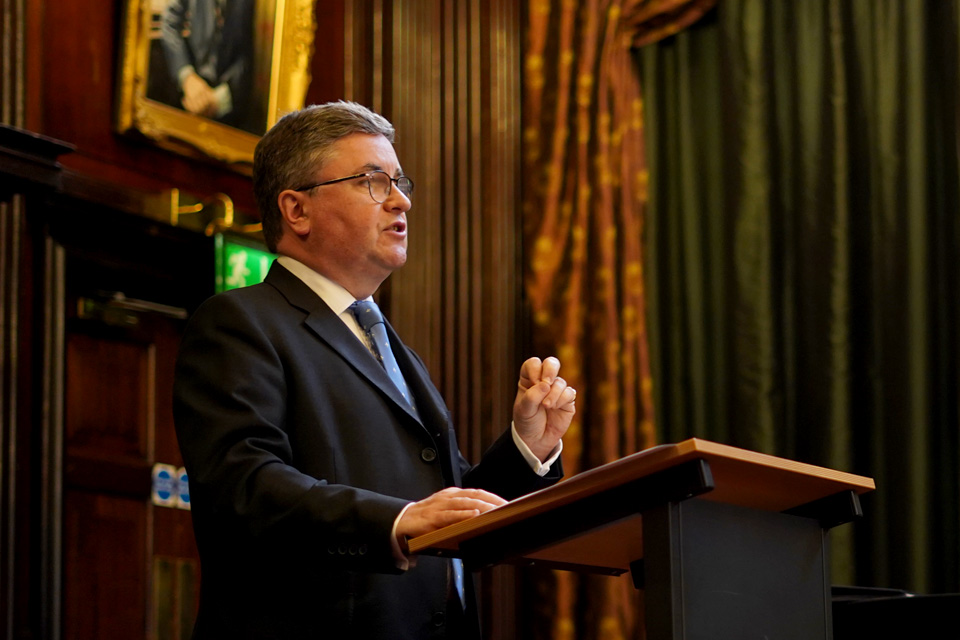 Lord Chancellor Robert Buckland speaking at a lectern