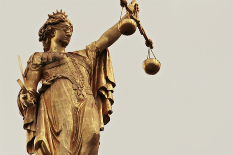 This image shows a statue of Lady Justice