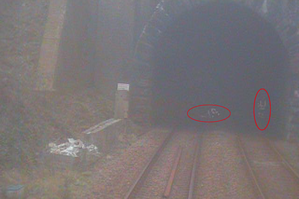 Red circles highlight location of trackworkers on track at Llandegai tunnel