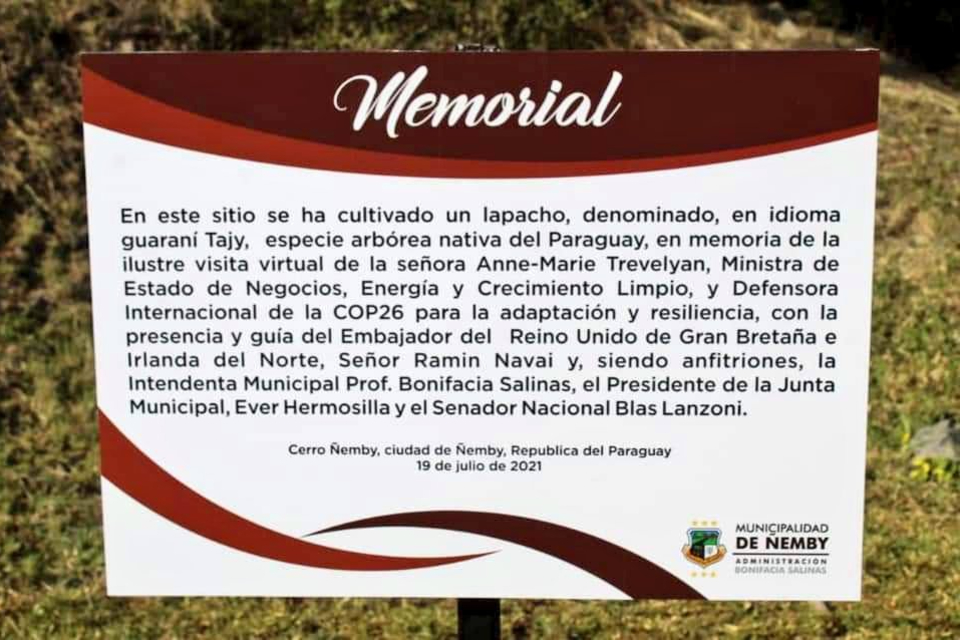 Close up of memorial sign at tree planting site.