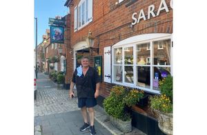 Tied pub tenant outside pub