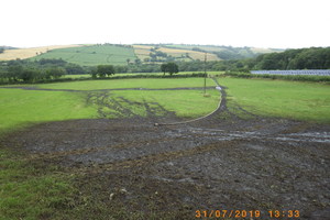 A field covered with brown deposit called digestate