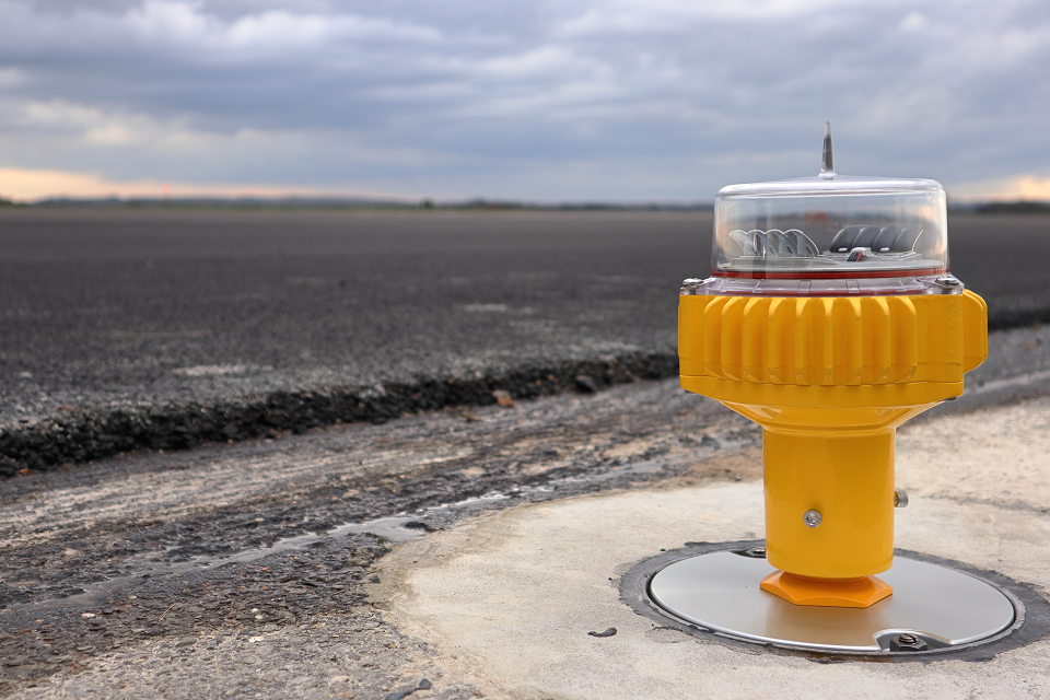 One of the new airfield ground lights at RAF Odiham, next to the resurfaced runway.