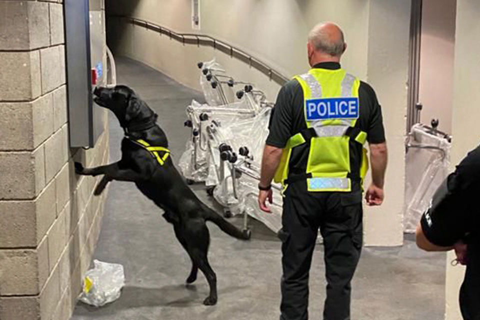 Police dog and handler working with Police Scotland during National Canine Training Exercise at Scottish Event Campus ahead of COP26