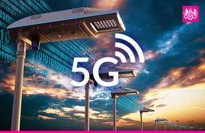 A picture of a line of streetlights with text in the middle that says "5G"