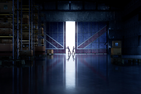 Warehouse with union flag on doors that are being opened 
