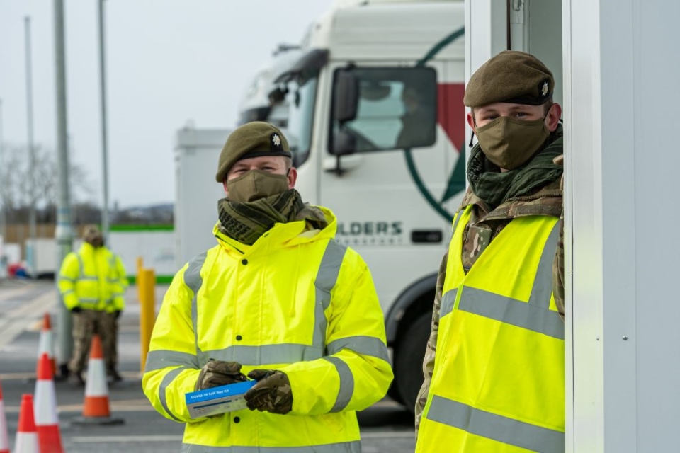 Two Army Reservists help with COVID testing of hauliers.
