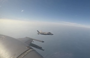 An F-35B Lightning jet from the UK Carrier Strike Group, seen from a Republic of Singapore Air Force's F-16 fighter