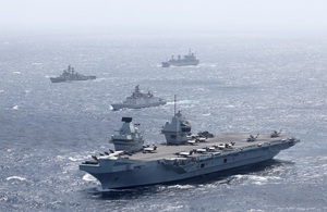 HMS Queen Elizabeth of UK Carrier Strike Group in company with an Indian Shivalik Multi-role Frigate during Maritime Partnership Exercises in the Bay of Bengal.