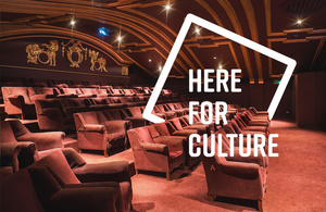 An image of a cinema with the words: Here For Culture