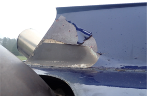Paint blistering on engine cowling adjacent to right engine inboard exhaust tube