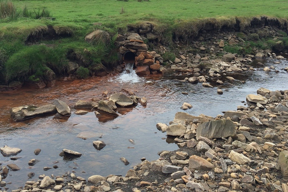 Mine water discharging from the Tailrace Level into Rookhope Burn