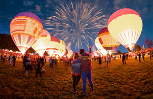 an image showing two people watching Bristol International Balloon Fiesta