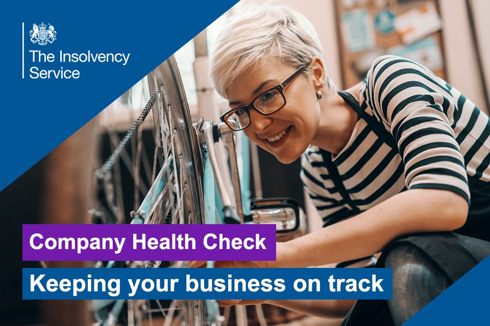Small business owner repairing a bicycle in a workshop with the title 'Company health check - Keeping your business on track'