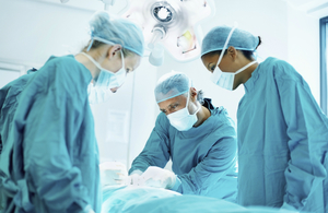 Surgeons working in operating theatre