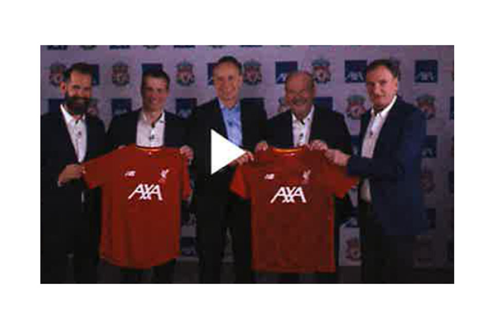 People holding Liverpool jersey sponsored by AXA