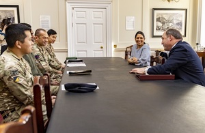 Home Secretary Priti Patel and Defence Secretary Ben Wallace with non-UK service personnel