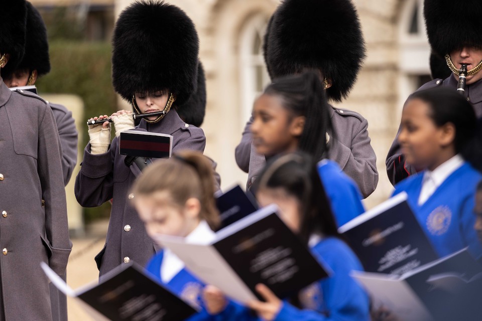 The Band of the Scots Guards and Commonwealth Youth Orchestra and Choir performing at Horse Guards Parade for a Commonwealth Day service.