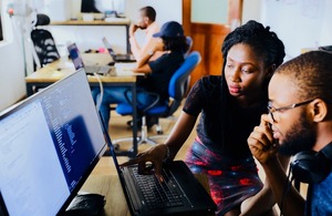 Two people using a computer
