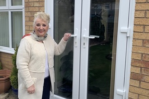 Rita Taylor, 79, about to open her patio door and enter her house