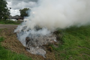 Smoke coming off a bonfire on farmland