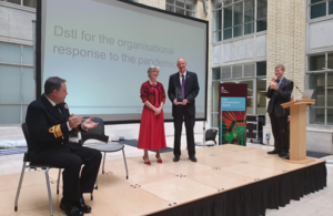 Ministry of Defence Chief Scientific Advisor presents an award to Dstl staff