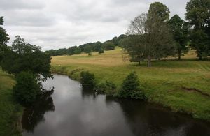 Park and river in the River Derwent, Derbyshire.