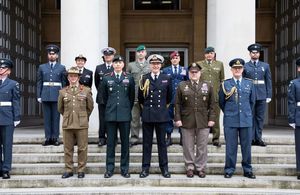 The five Chiefs of Defence standing on the steps of the Ministry of Defence, flanked by personnel from the RAF Regiment.