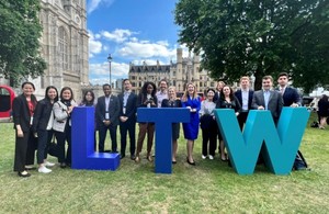 The Australian and New Zealand London Tech Week delegates stand in front of LTW lettering on day one of the festival