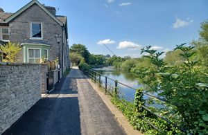 Houses on the left and path leading to Busher walk, and the River Kent on the right