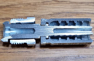 Sample pilot hose coupling, sectioned through, to show the imcomplete bore hole in the stem