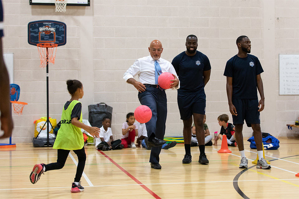 Chancellor sees government support for families in action at school holiday club