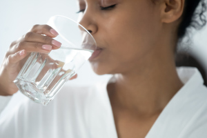 Woman drinking glass of water 