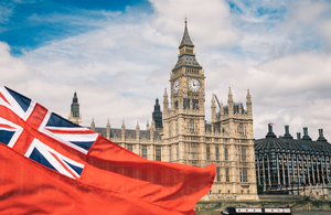 Red Ensign flag flying in front of the House of Parliament
