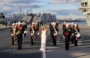 Katherine Jenkins OBE performs God Save The King on Board the HMS Queen Elizabeth aircraft carrier against the New York skyline