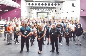 200 new apprentices are standing in a group with their tutors