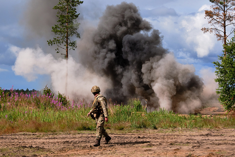A soldier witnessing an explosion 