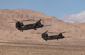 Two Chinooks landing as part of the live demonstration at Project Convergence in Fort Irwin.