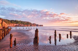 Sunrise over a beach in Whitby