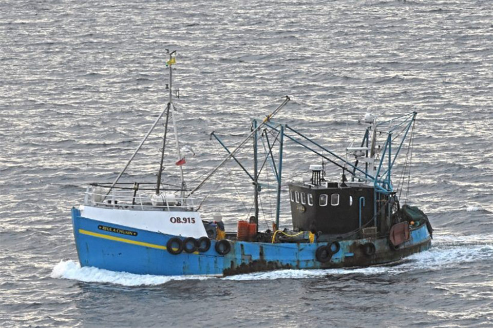 A side-on view of the twin-rigged prawn trawler Reul A Chuain at sea.