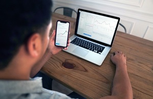 Man with Mobile and Laptop