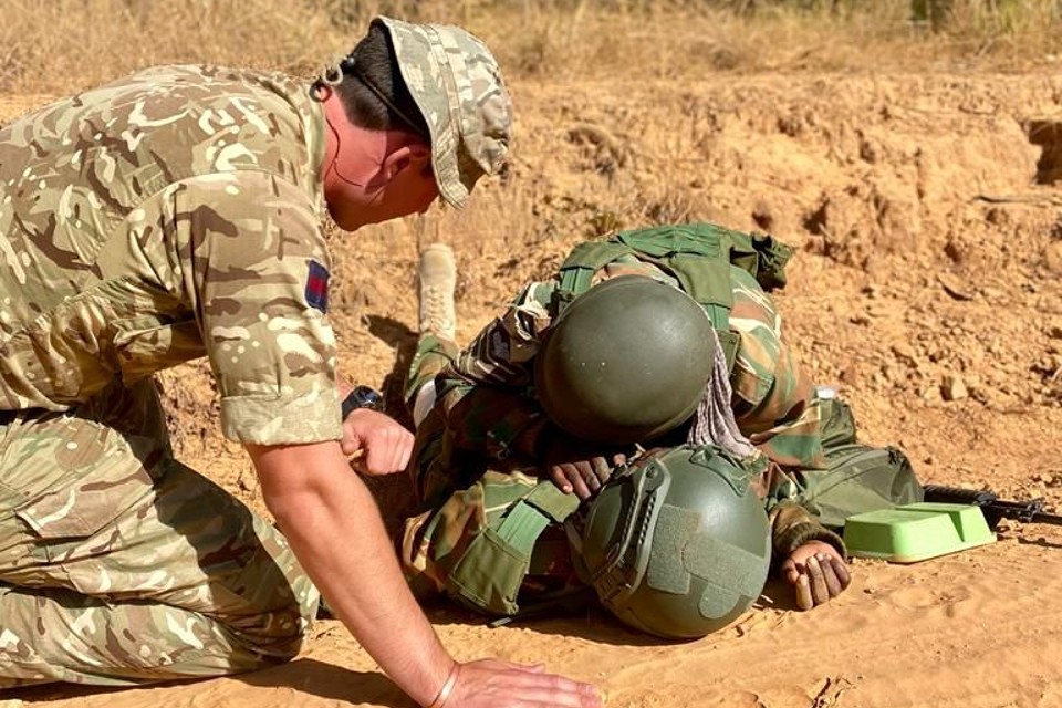 A British soldier training members of the Zambia Defence Forces (ZDF) at the Kenneth Kaunda Peace Training Centre in Nanking, Zambia.