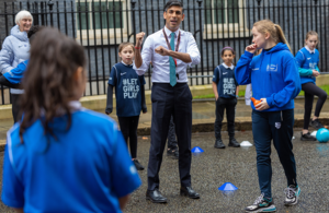 PM Rishi Sunak with school children outside Downing Street on International Women's Day