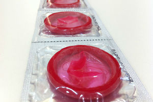 Red condoms in sealed silver packets