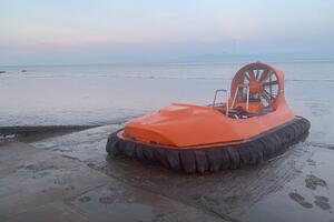 Photo shows: Hovercraft on intertidal mudflats 