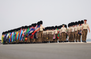 People in military uniform march